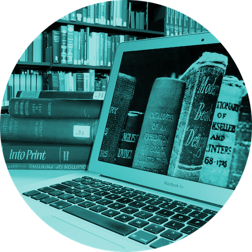 Laptop and books in library